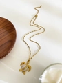 Detail of 18K gold sea turtle pendant with pearl shell inlay and elegant link chain - Sea Turtle