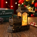 Nahaufnahme der Vintage Bronze Weihnachtszug Laterne mit LED Licht und Schneeszene - Bronze Gebürstetes Gold Schneemann