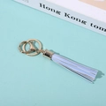 Close-up of light blue PU leather tassel keychain with gold metal clasp and ring detail - Sky Blue