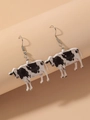 Cow-shaped acrylic drop earrings with black and white spotted pattern and silver hooks - Cow Print Style