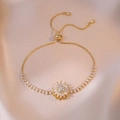 Detail of adjustable gold sunflower bracelet with cubic zirconia on silk background - Ts0194 Gold --1