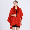 Elegant red knit cape with faux rabbit fur collar and decorative tassel detail - Red