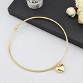 Elegant gold snake chain choker with heart pendant displayed on black jewelry box - Gold