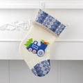 Cream Christmas stocking with blue train appliqué and cozy faux fur trim hanging - Blue