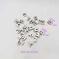 Macro shot of silver letter beads with dimensions 1.2x1cm and hole size detail - Small White K Mixed Color Perforated Letters Plated