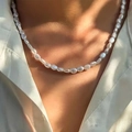 Elegant baroque pearl necklace with irregular white pearls on a model neck - Baroque Pearl Necklace / White