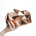 Metallic rose gold geometric evening clutch bag with faceted design and top prism clasp - Champagne