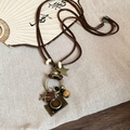 Macro detail of vintage necklace with bronze pendants and beads on rustic linen - 12# Wax Cord Camera Pendant Necklace
