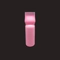 Pink hair dye squeeze bottle detail with comb nozzle and molded scale markings - Solid Pink