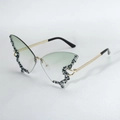Exaggerated butterfly rhinestone sunglasses with gradient green lenses and rimless design. - Gradient Green