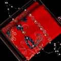 Red cashmere-like scarf featuring multi-color floral embroidery and pearl accents - Red