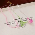 Detailed close-up of a two-piece floral beaded necklace with a tulip pendant and gold clasp - 2-Piece Seed Bead Flower Necklace Set