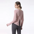 Pink long sleeve sports top for women with deep V-back design and side slit hem detail - S / Pink