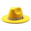 Detail of a bright yellow fedora hat featuring a sparkling gold and silver crystal band - Yellow