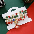 Lot de quatre bracelets de Noël perlés avec breloques festives sur carte de support - SY0673-Éléments de Noël Mixte Ensemble de 4 pièces