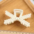 Elegant large 11.5cm hair claw clip with white faux pearl embellishments for women - Crisscross Hollow