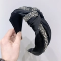 Sparkling black satin knotted headband featuring silver rhinestone embellishments - Black