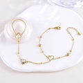 Elegant gold finger bracelet with heart-shaped colorful gemstones and delicate chain link - Three Hearts