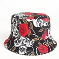 Detail of dark style bucket hat featuring realistic skull and red rose floral prints - Rose