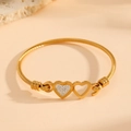 Detail of gold double heart bangle with twisted wire texture and inlaid diamonds - Double Heart Paved Style (R709)