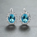 Champagne gold earrings with oval blue gemstone and white zircon halo setting - Platinum Plated Aquamarine Zircon