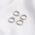 Detailed view of silver spring ring clasps for jewelry making on white fabric - Platinum Color Egg Shape Spring Clasp 14x11mm