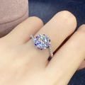 Elegant silver four-prong round solitaire ring with pave set stones on a model hand - Eight Hearts And Eight Arrows [2 Carats] 8mm Ljz-09 / Adjustable Open