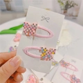 Close-up of pink beaded bow hair clips with rhinestones on a white display card - Pastel Pearl Butterfly BB Clips (Pair)