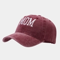 Detail of MOM embroidery on a burgundy washed cotton baseball cap with retro texture - MOM Style / Burgundy