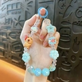Adorable Capybara beaded phone strap featuring blue star and flower charms for girls - Capybara Beaded Charm / Random Hand-painted Beads / Blue