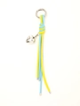 Detail of blue and yellow braided leather keychain with silver heart pendant macro view - Blue and Yellow