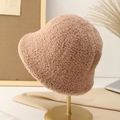 Khaki faux shearling bucket hat for women on a gold stand for autumn and winter warmth - Khaki