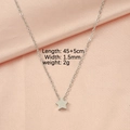 Detail showing a 45+5cm silver star pendant necklace on pink silk fabric background - Star Shape (MP101-1) / Silver Stars
