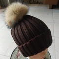 Dark brown knitted beanie with a large light brown faux fur pom pom on top - Coffee