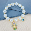 Bohemian pearl beaded bracelet with gold Fatima hand and colorful evil eye charms - Palm Hamsa