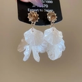Detail view of S925 silver needle earrings with crystal and white layered flower petals - Brown Petal (Silver Needle)