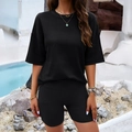 Women's black knit two-piece lounge set with short sleeve top and matching shorts - S / Black