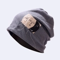 Close-up of grey waffle knit beanie featuring a minimalist abstract face patch detail - M (56-58cm) / Fog Blue