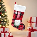 Red and black plaid Christmas stocking with a plush gnome and white faux fur cuff decoration - Red Plaid