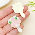 Handheld view of pink enamel flower bouquet alloy pendant with golden metal back - 35x25mm Carnation Bouquet