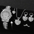 Silver iced-out watch set with rhinestone heart necklace and bracelet on black background - Watch, Necklace, Bracelet, Earrings And Ring Set / Silver