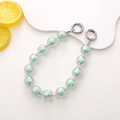Close-up of colorful acrylic diamond beads chain with silver round spring clasps - Green
