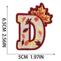 Detail of embroidered letter D patch with autumn leaf motif and dimensions 6.5cm by 5cm - Letter D