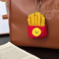 Handmade wool felt French fries keychain charm hanging on a luxury designer bag - Happy Fries