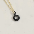 Minimalist gold necklace featuring a black spray-paint smiley face pendant accessory - Black