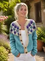 Close-up of floral jacquard patterns and buttons on a blue and beige cardigan - S / Tops / Tulip Blue