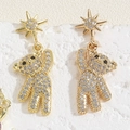 Detailed view of gold bear earrings with star studs and clear rhinestones on stone - Hexagram Bear (ES2289)