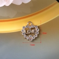 Golden heart pendant with sparkling rhinestones and hollow LOVE lettering, 18x16mm size - 125 Gold