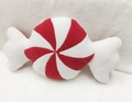 Detail of red and white spiral stripe candy plush pillow with soft sherpa fabric texture - Candy Shape