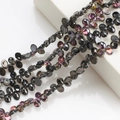 Detail of 6x12mm iridescent black glass moon beads for DIY jewelry making and crafts - Half Gun Black Purple